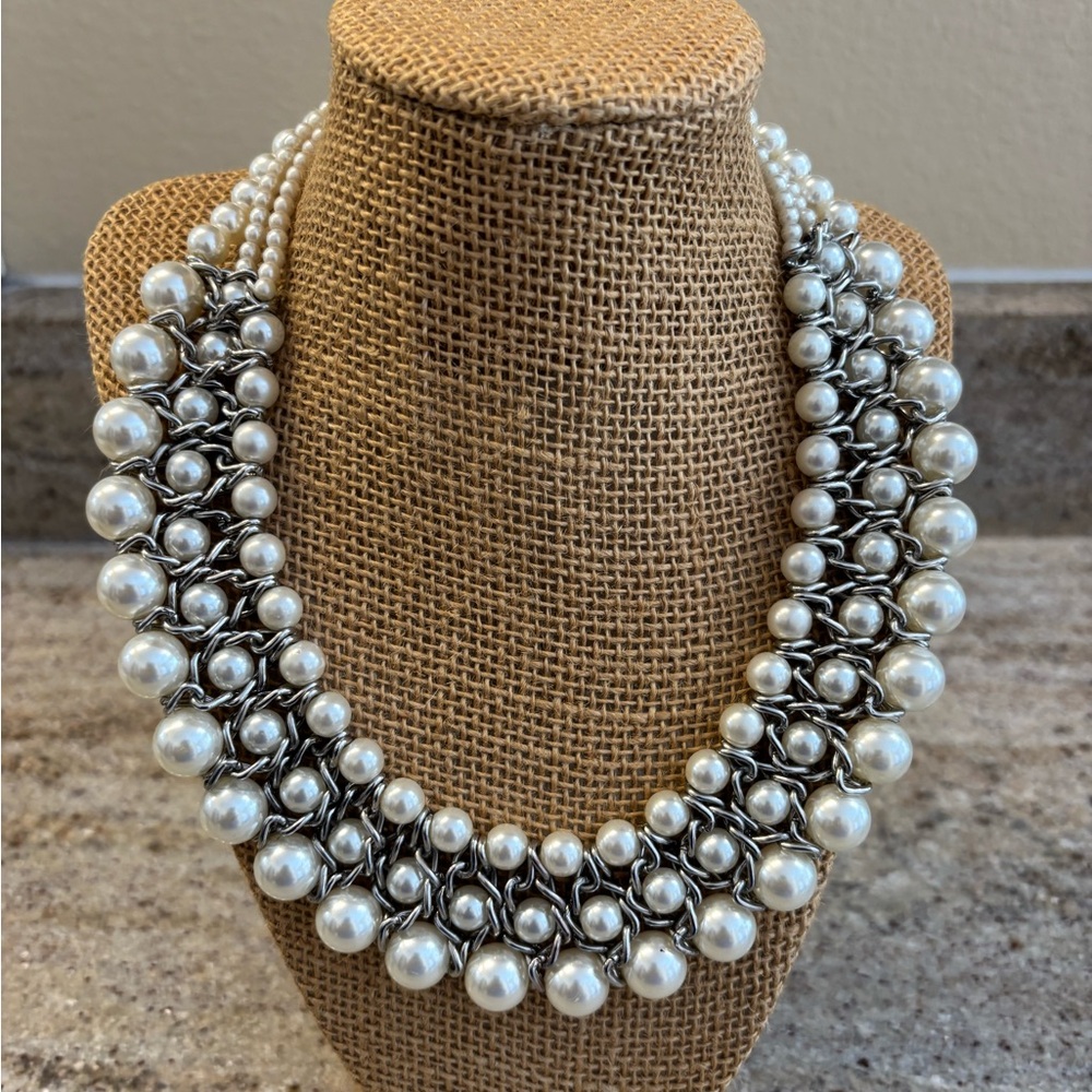 Faux three strand faux pearl bib necklace
